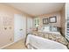 Cozy bedroom with a bed and bright natural light from the windows, and neutral walls at 1008 Mockingbird Dr, Raleigh, NC 27615