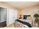 Bright bedroom featuring a bed, neutral walls, carpet, and a plant that brings life to the space at 1008 Mockingbird Dr, Raleigh, NC 27615
