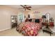 Cozy bedroom featuring a ceiling fan, plush bedding, and a serene atmosphere for restful nights at 1008 Mockingbird Dr, Raleigh, NC 27615