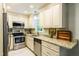 Updated kitchen with stainless steel appliances, granite countertops and lots of cabinet space at 1008 Mockingbird Dr, Raleigh, NC 27615