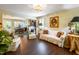 Bright living room featuring hardwood floors, comfortable seating, and dining room, perfect for entertaining guests at 1008 Mockingbird Dr, Raleigh, NC 27615