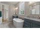 Luxurious bathroom featuring dual vanities, soaking tub, and modern fixtures at 1029 Whitehall Cir, Durham, NC 27713
