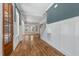 Inviting entryway with wood door, hardwood floors, staircase and stylish wainscoting at 1029 Whitehall Cir, Durham, NC 27713