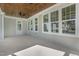 Covered patio with concrete floors and wood ceiling for enjoying outdoor living at 1029 Whitehall Cir, Durham, NC 27713