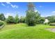Spacious backyard with lush green grass and mature trees, providing a private outdoor space at 105 Walehurst Ridge Dr, Angier, NC 27501
