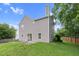 Well-maintained backyard featuring a concrete patio, lush lawn, and privacy fence at 105 Walehurst Ridge Dr, Angier, NC 27501
