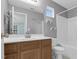 Bathroom features a wood vanity, white countertop, and a shower/tub combo at 105 Walehurst Ridge Dr, Angier, NC 27501