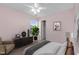 A cozy bedroom with an accent wall, a dresser, and an upholstered chair at 105 Walehurst Ridge Dr, Angier, NC 27501