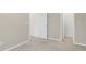 A bedroom with neutral walls that opens to a closet with shelving at 105 Walehurst Ridge Dr, Angier, NC 27501