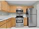 This bright kitchen has stainless appliances and light wood cabinets at 105 Walehurst Ridge Dr, Angier, NC 27501