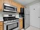 Stainless steel appliances, including refrigerator, range, and microwave in the kitchen at 105 Walehurst Ridge Dr, Angier, NC 27501