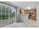 Open living area with outdoor views into the backyard and view into the kitchen at 105 Walehurst Ridge Dr, Angier, NC 27501