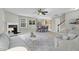 Bright living room with fireplace, ceiling fan, and dining area, creating a warm and inviting atmosphere at 105 Walehurst Ridge Dr, Angier, NC 27501