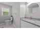 Bathroom features a granite countertop vanity, updated fixtures and natural light at 1052 Hughes Trl, Elon, NC 27244