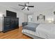 Spacious main bedroom features a ceiling fan, hardwood floors and lots of storage space at 1052 Hughes Trl, Elon, NC 27244