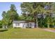 Charming single-story home with a white exterior and a well-manicured lawn at 1109 N Pinkston St. St, Henderson, NC 27536