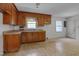 Functional kitchen with wood cabinets and linoleum flooring, ready for customization at 1109 N Pinkston St. St, Henderson, NC 27536