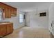 Functional kitchen with wood cabinets and linoleum flooring, ready for customization at 1109 N Pinkston St. St, Henderson, NC 27536