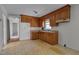 Functional kitchen with wood cabinets and linoleum flooring, ready for customization at 1109 N Pinkston St. St, Henderson, NC 27536