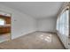 Spacious living room with large windows and a doorway leading to the kitchen at 1109 N Pinkston St. St, Henderson, NC 27536