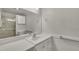 Clean bathroom with a wide mirror, white cabinets, and accessibility features at 1115 Chestnut Dr, Smithfield, NC 27577