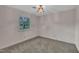 A carpeted bedroom with a window overlooking the outside at 1115 Chestnut Dr, Smithfield, NC 27577