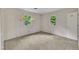 Bright bedroom with two windows providing ample natural light at 1115 Chestnut Dr, Smithfield, NC 27577