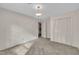 A carpeted bedroom with a window and a closet for storage at 1115 Chestnut Dr, Smithfield, NC 27577