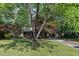 The lawn and shade trees surrounding the house provides cool shade in the summer at 1115 Chestnut Dr, Smithfield, NC 27577