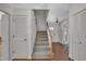 Inviting foyer with staircase, coat closet and tile flooring at 1115 Chestnut Dr, Smithfield, NC 27577