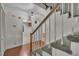 Entryway with staircase with carpet runner, wood railing and white risers at 1115 Chestnut Dr, Smithfield, NC 27577