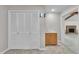 This hallway features tiled flooring, a closet, a wet bar and a doorway with an open view to a fireplace at 1115 Chestnut Dr, Smithfield, NC 27577