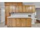 The kitchen area features light wood-stained cabinets, white countertops and an additional counter space at 1115 Chestnut Dr, Smithfield, NC 27577