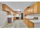 Spacious kitchen features classic wood cabinets, ample countertop space, and modern appliances at 1115 Chestnut Dr, Smithfield, NC 27577