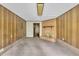 Living room showcases wood-paneled walls and brick fireplace adding warmth at 1115 Chestnut Dr, Smithfield, NC 27577