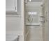 Walk-in shower features glass doors, chrome fixtures, and accessibility grab bars at 1115 Chestnut Dr, Smithfield, NC 27577