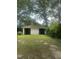 Spacious detached two-car garage, perfect for parking and storage, set in a lush green yard at 112 E Sycamore St, Zebulon, NC 27597