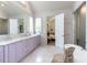 Luxurious bathroom featuring marble counters, double sinks, and a glass-enclosed shower at 115 Founders Ridge Dr, Chapel Hill, NC 27517