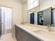 Bathroom featuring double sinks, quartz countertop, and bright mirror at 115 Founders Ridge Dr, Chapel Hill, NC 27517