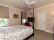 Warm bedroom with floral print bedding, canopy bed, and television at 115 Founders Ridge Dr, Chapel Hill, NC 27517