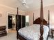 Charming bedroom with four-poster bed, ceiling fan, and neutral décor at 115 Founders Ridge Dr, Chapel Hill, NC 27517
