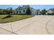 Spacious driveway leading to an attached two-car garage and complementing the home's exterior design at 115 Founders Ridge Dr, Chapel Hill, NC 27517