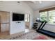 Bright exercise room with a treadmill, free weights, and scenic window views at 115 Founders Ridge Dr, Chapel Hill, NC 27517