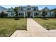 Charming home with a symmetrical facade, manicured lawn, and a welcoming walkway to the front door at 115 Founders Ridge Dr, Chapel Hill, NC 27517