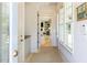 Inviting hallway with ample natural light, storage, and entry to living room at 115 Founders Ridge Dr, Chapel Hill, NC 27517