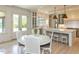 Bright eat-in kitchen with island, breakfast bar, hardwood floors and stainless appliances at 115 Founders Ridge Dr, Chapel Hill, NC 27517