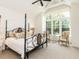 Bright main bedroom with vaulted ceiling, large window and decorative furniture at 115 Founders Ridge Dr, Chapel Hill, NC 27517