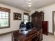 Elegant home office featuring custom built-ins, natural light, and hardwood floors at 115 Founders Ridge Dr, Chapel Hill, NC 27517