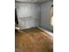 Interior view of a living room with beautiful hardwood floors and classic details at 116 Dunstan Ave, Durham, NC 27707