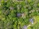 Aerial view of a beautiful house surrounded by mature trees and lush greenery at 118 Cavendish Ct, Hillsborough, NC 27278